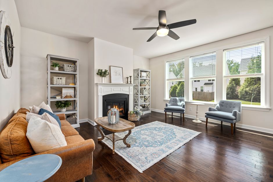 Bright modern living room featuring a cozy fireplace and stylish decor.